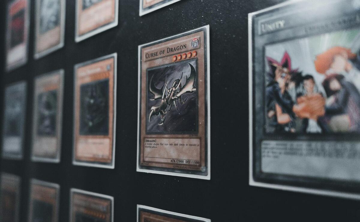 A close-up view of Yu-Gi-Oh! trading cards in a display case showcasing rare and collectible cards.