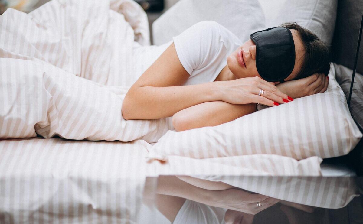 Young woman resting in bed in the morning