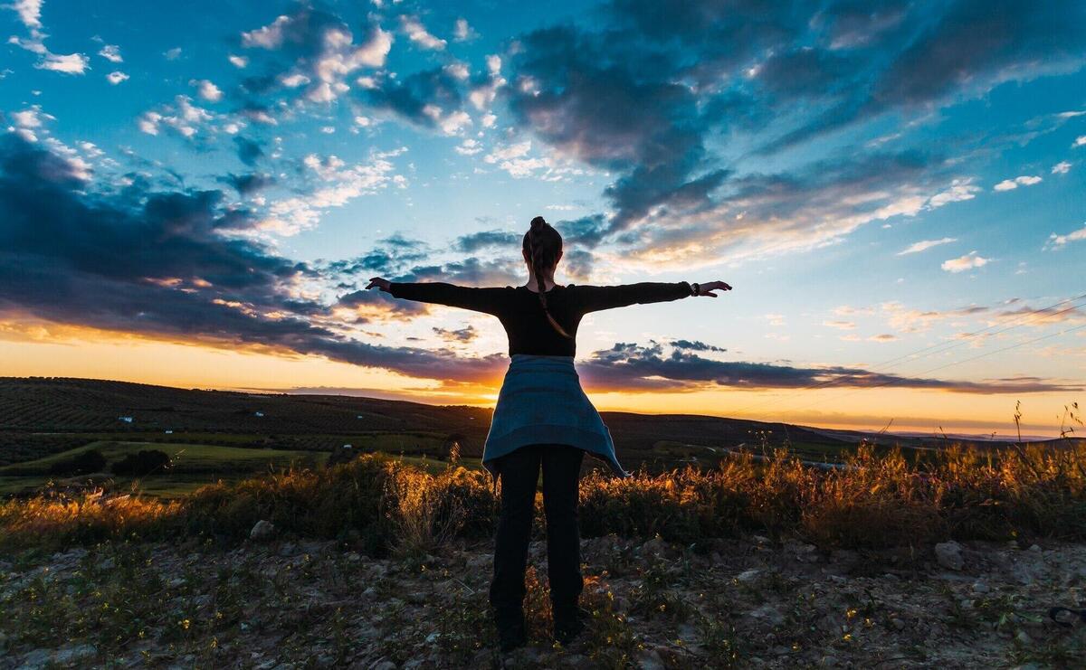 Silhouette shot of a young female hiker in the countryside in Spain