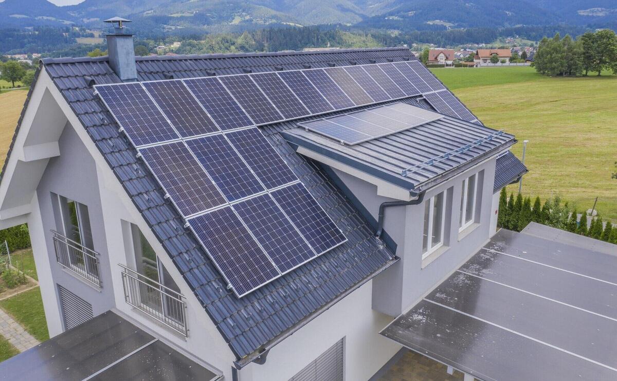 Aerial view of a private house with solar panels on the roof