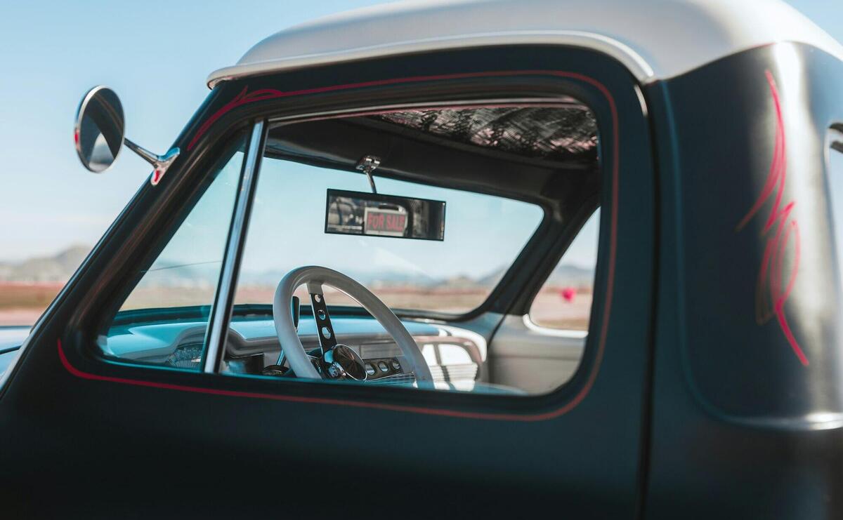 View of Interior of a Pick-up Truck Parked Outside under Blue Sky 