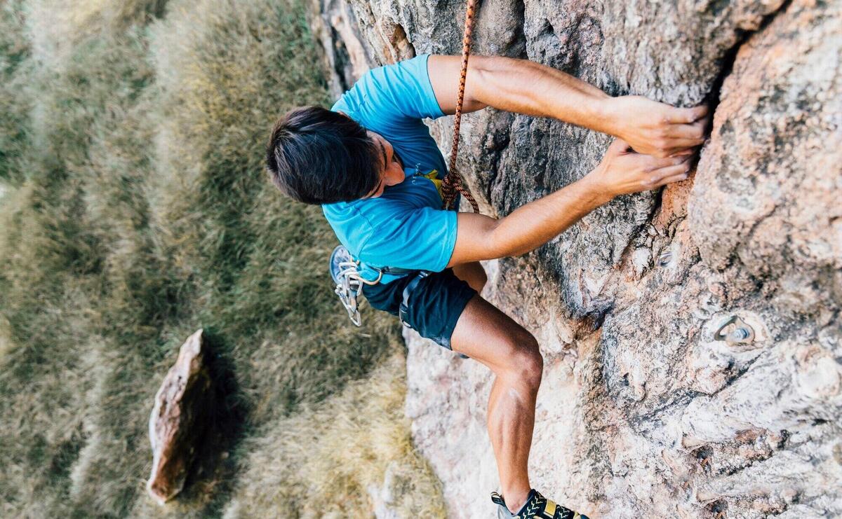 Rock climber on steep wall