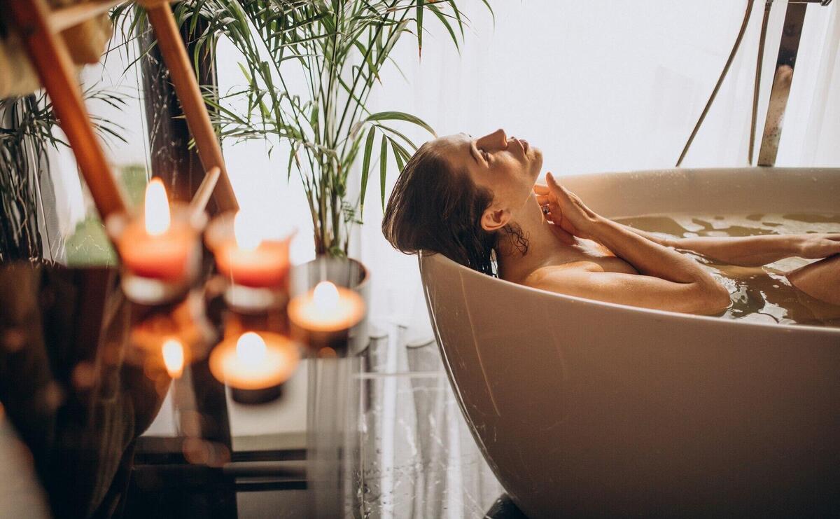 Woman relaxing in bath with bubbles