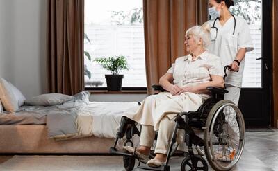 Doctor talking with her elder patient