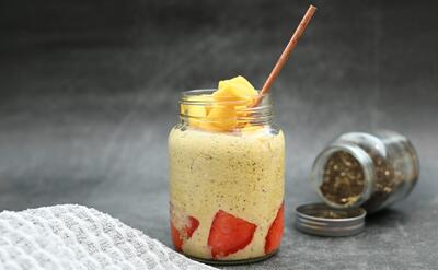 a jar of food with a straw sticking out of it