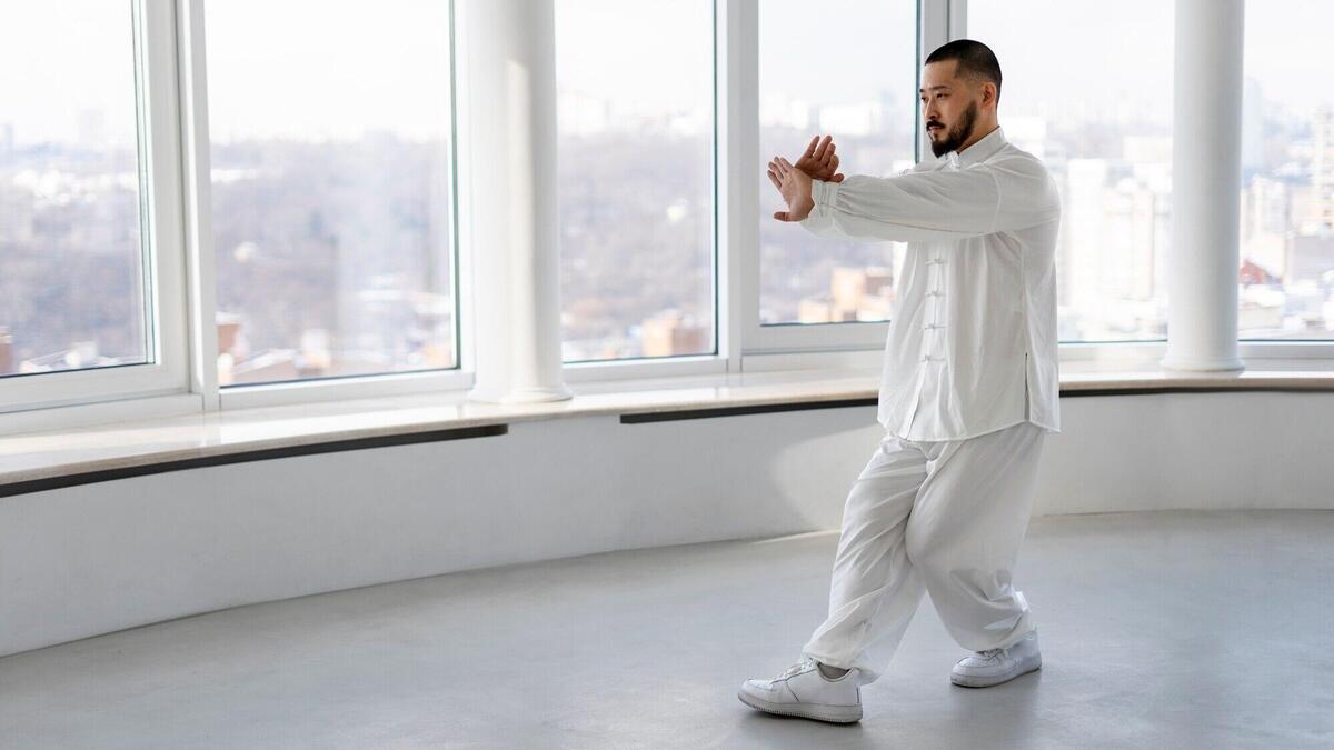 Person practicing tai chi indoors