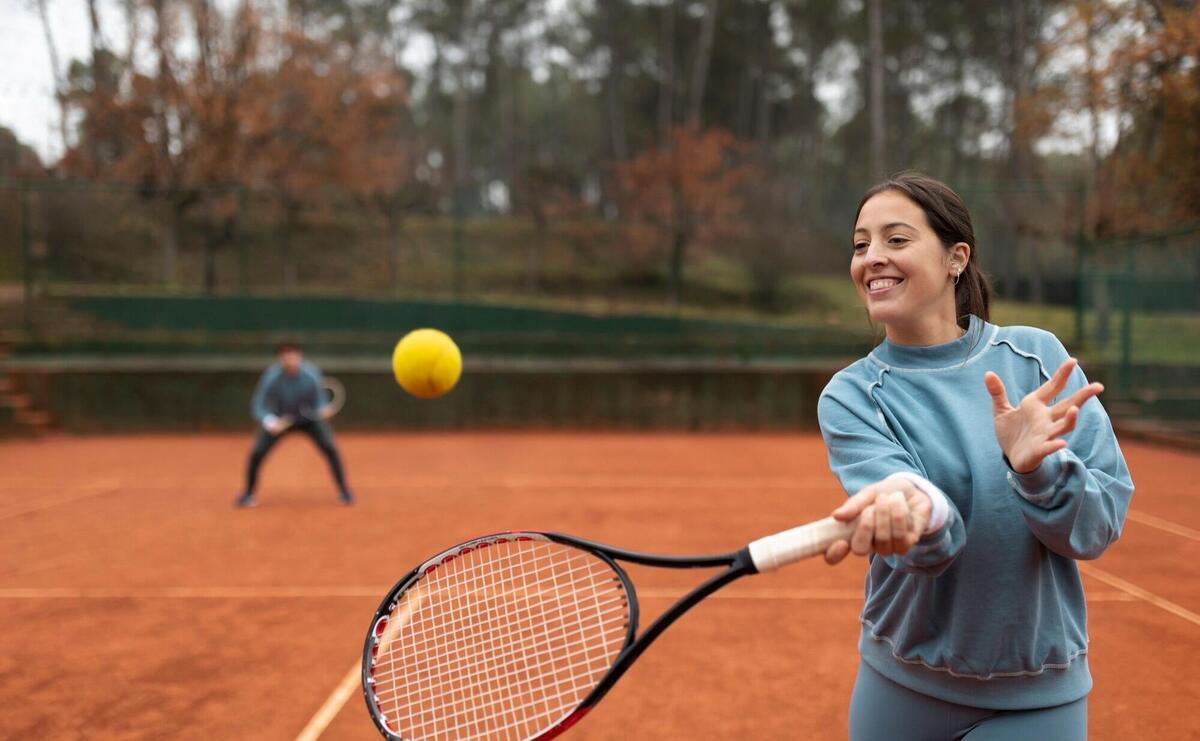 Person playing tennis game in winter time