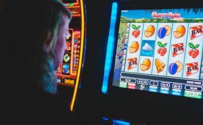 man playing slot machine game