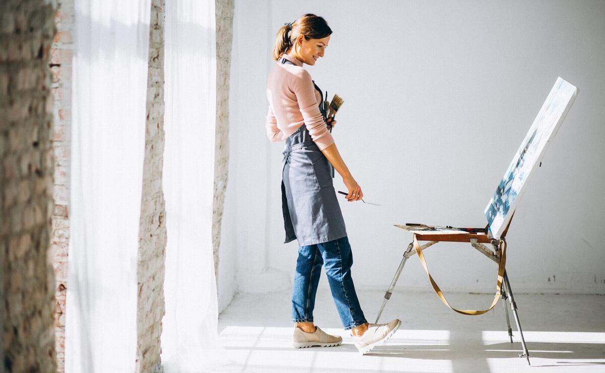 Female artist painting in studio