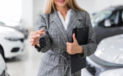 Front view of woman holding car keys