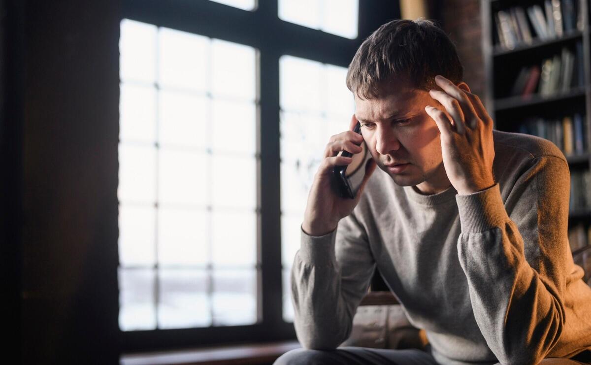 Portrait of adult male talking on the phone