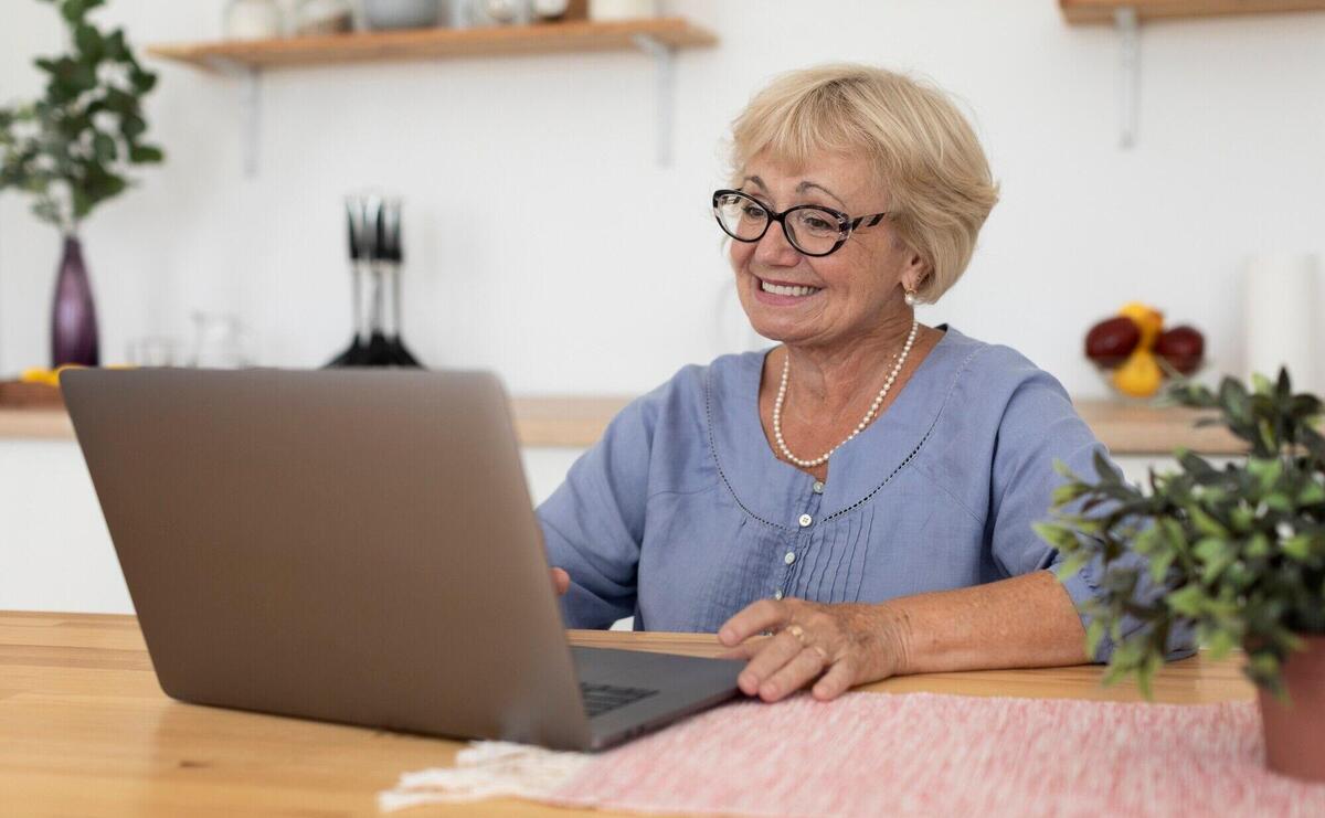 Senior woman having a videocall with her family