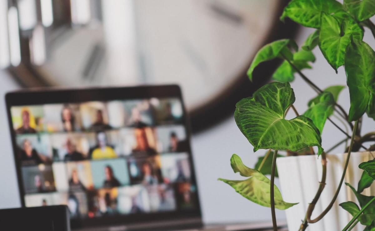 A laptop with online meeting running.