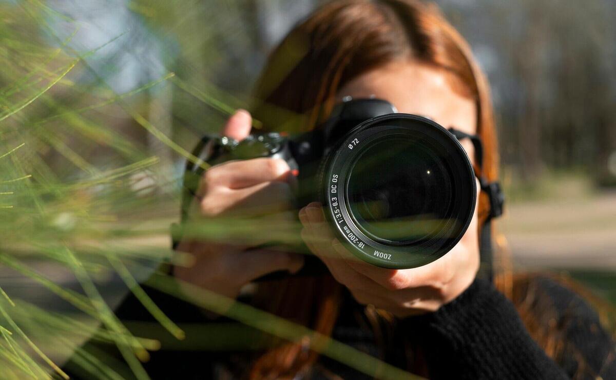 Front view photographer with camera