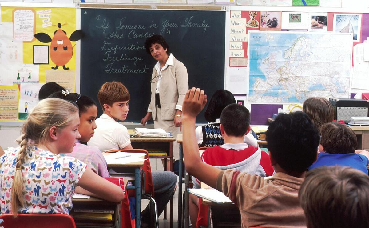 woman standing in front of children