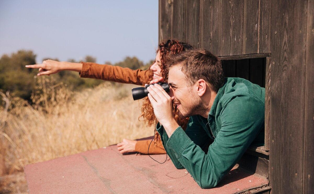 Sideways couple bird watching