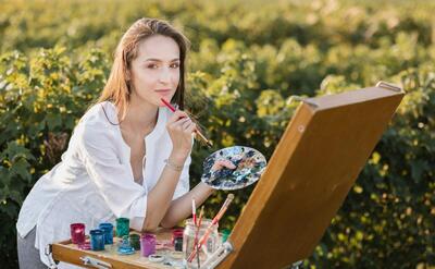 Creative woman in the nature painting