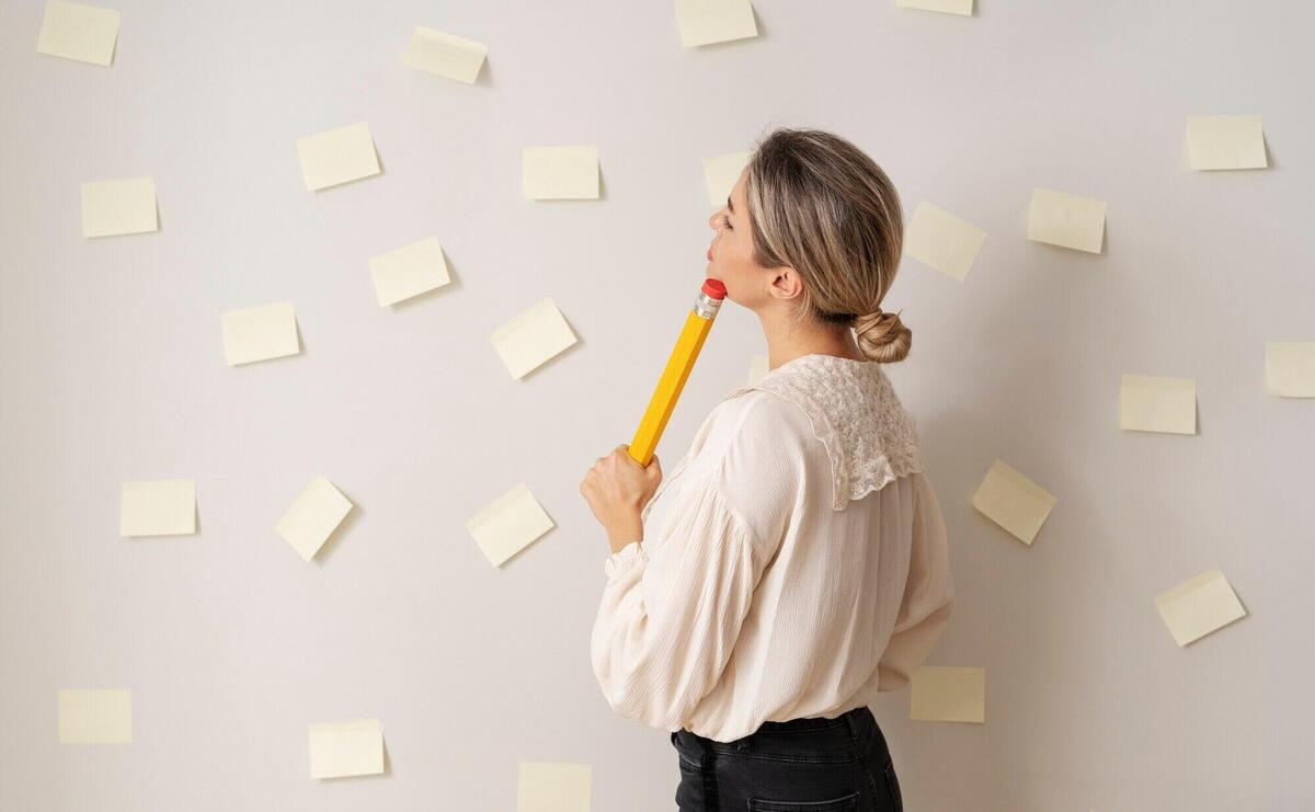 Medium shot woman with huge pencil