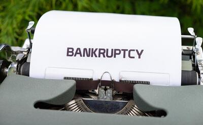 Typewriter, bankruptcy, money
