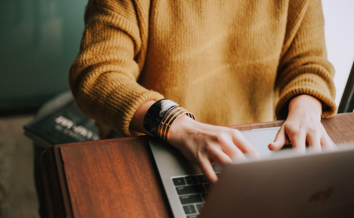 Person using laptop computer.