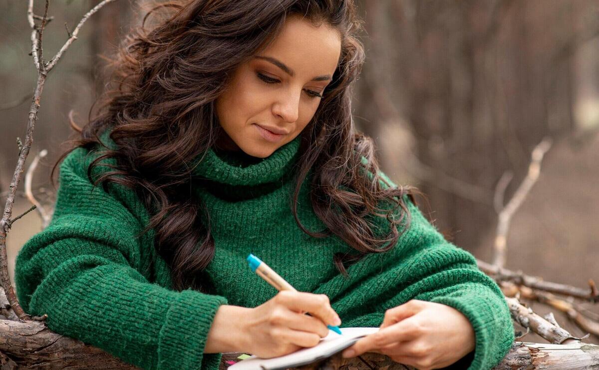 Woman in nature writing