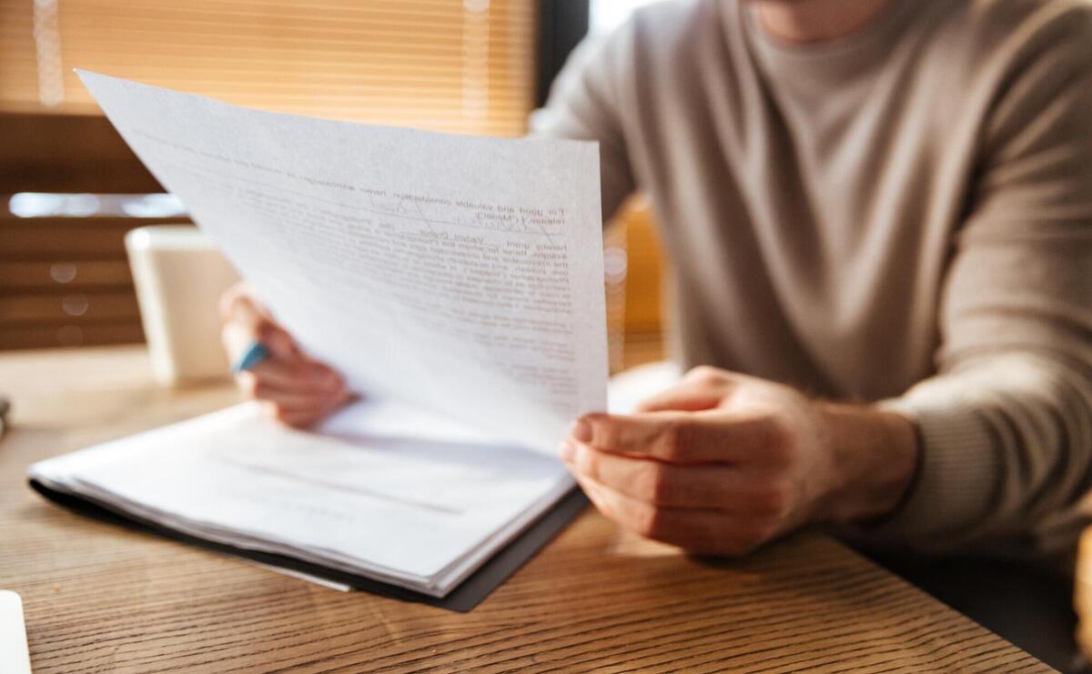 Cropped photo of attractive young man in office working