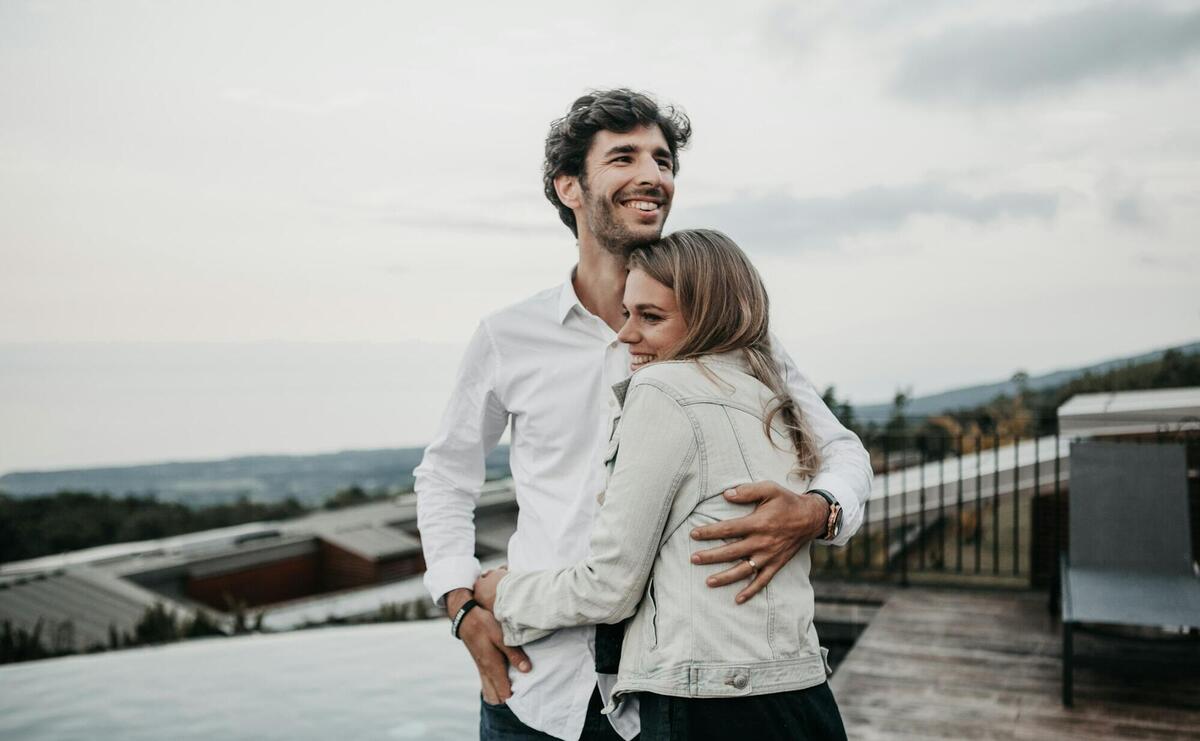 man and woman hugging each other