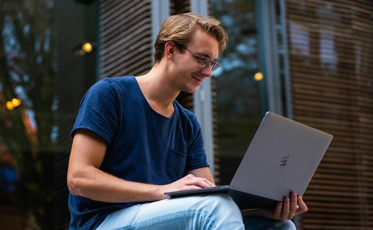 Selective Focus Photo of Man Using Laptop