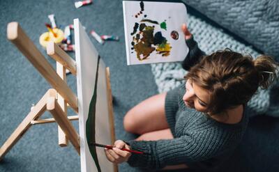 Top view of woman painting