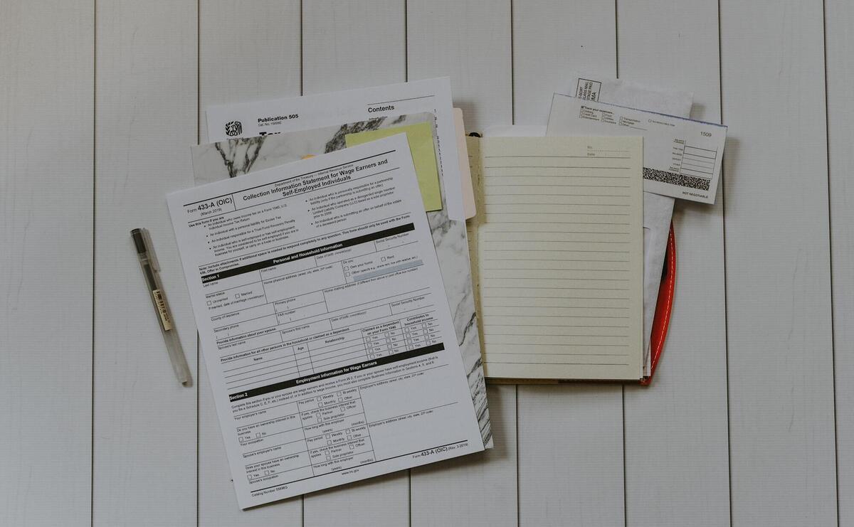 stack of papers flat lay photography