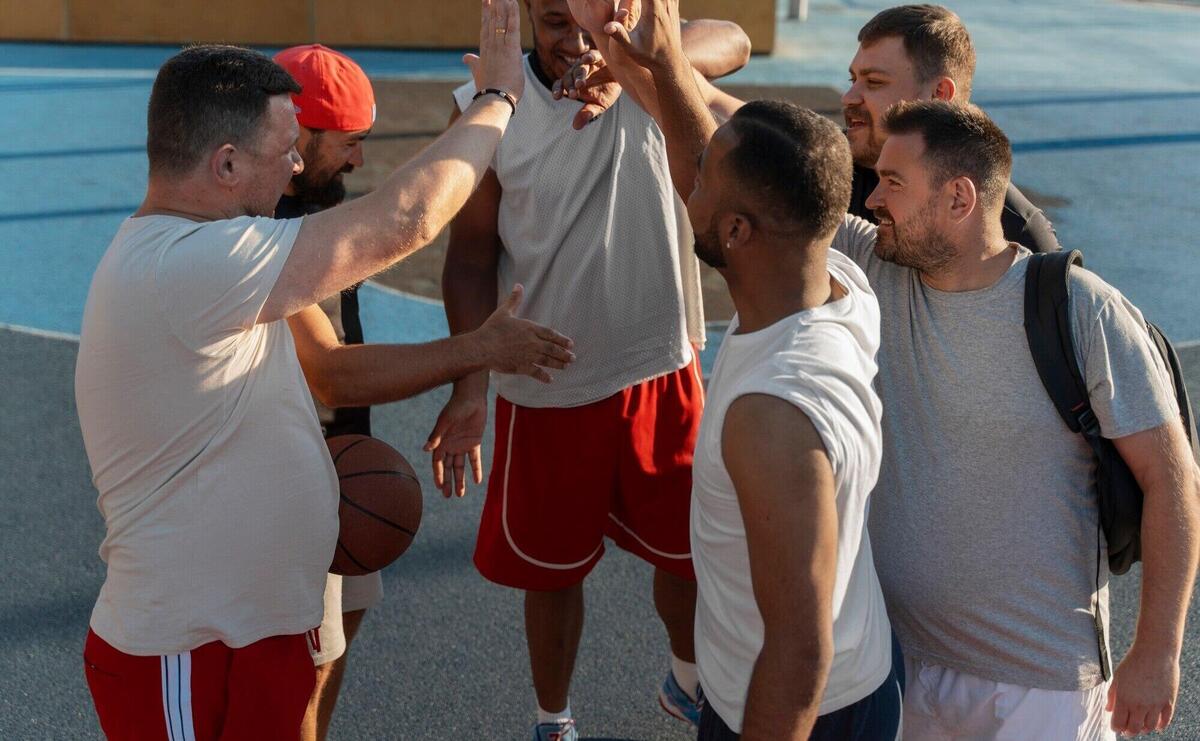 Authentic scenes of plus-size males playing basketball