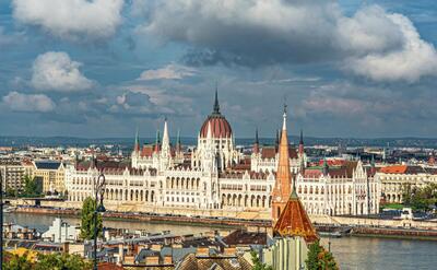 Aerial shot of Hungarian Parliament Building in Budapest, Hungary under a cloudy sky