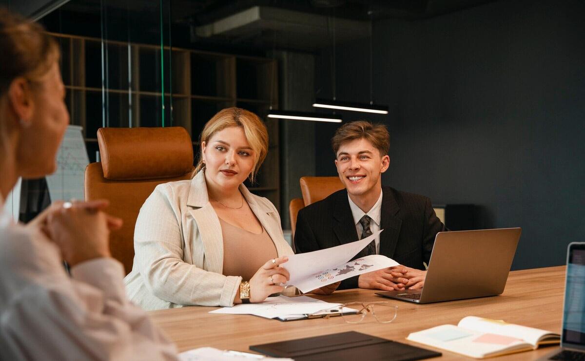 Plus-size woman business woman working with colleagues in a professional office