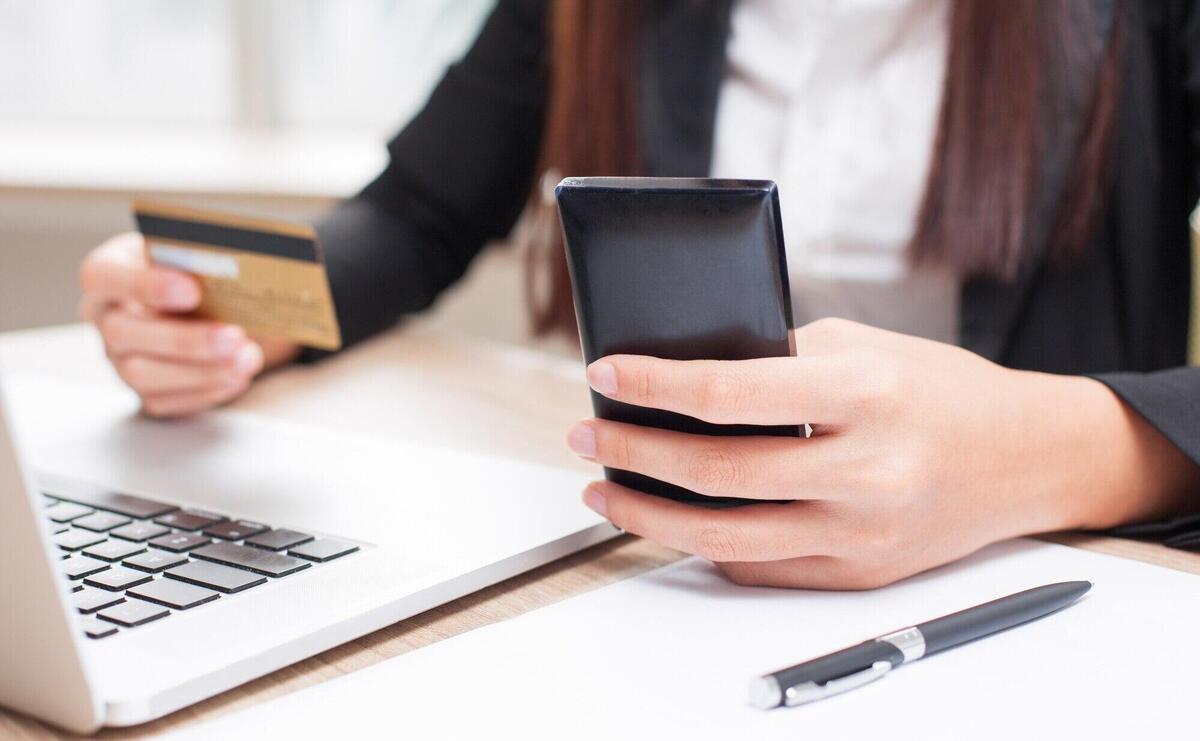 Cropped View of Businesswoman Doing Online Banking