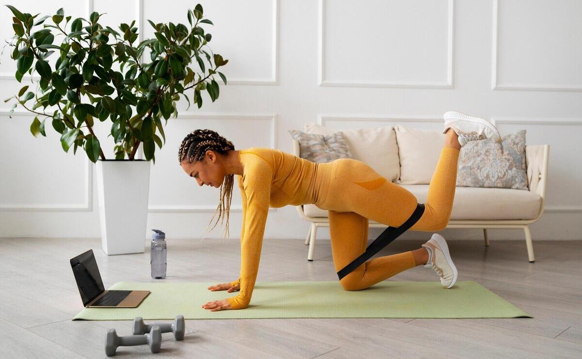 Black woman doing fitness at home