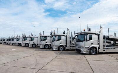 Group of trucks parked in line at truck stop