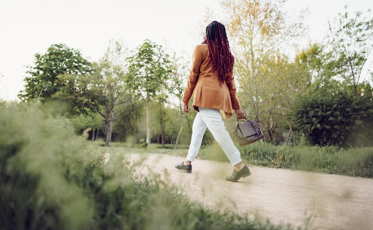 Young african american woman having a walk in a park