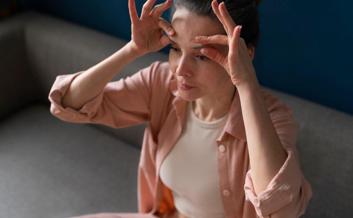 High angle woman practicing facial yoga