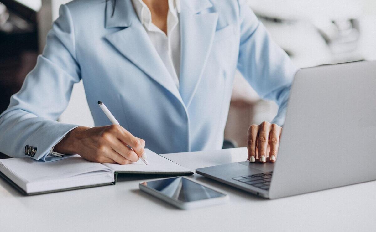 Business woman working in office on computer