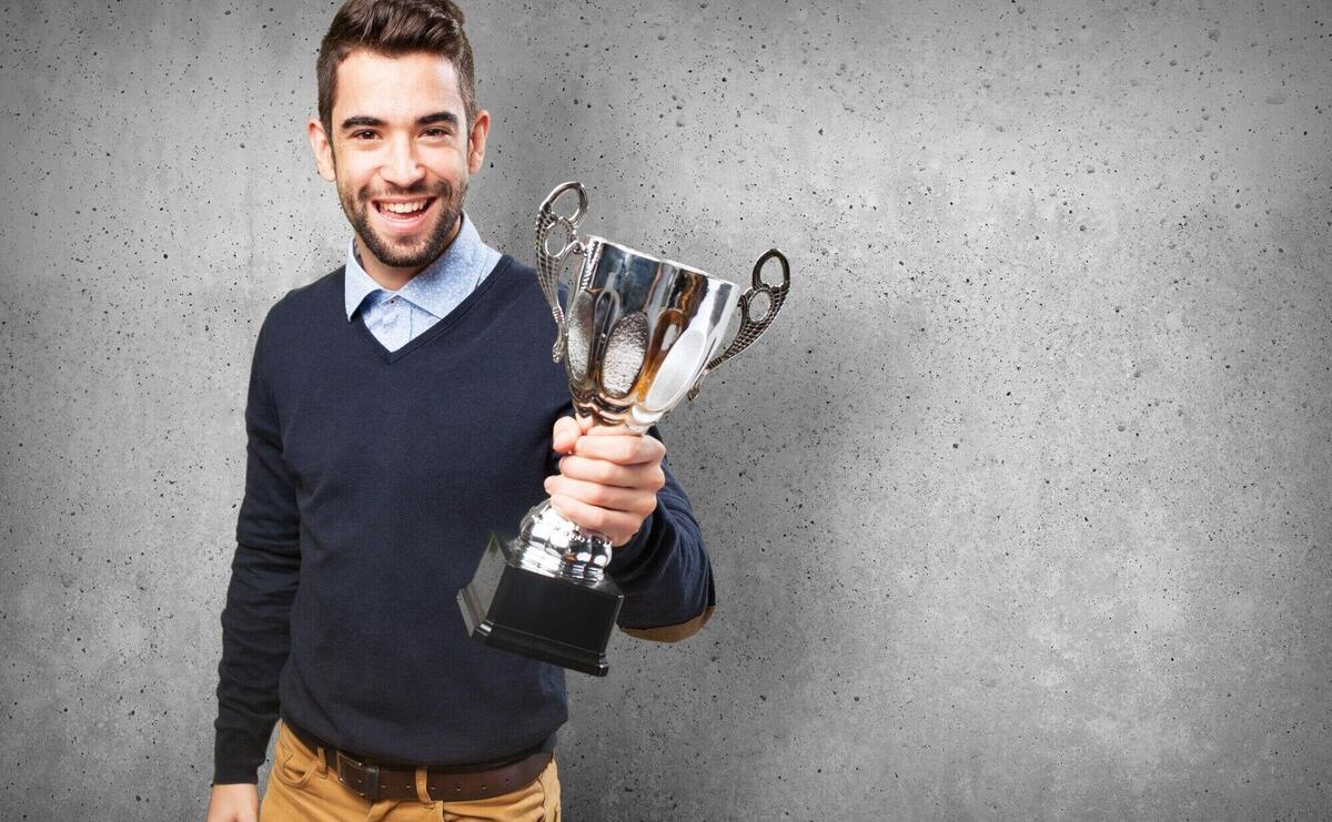 Happy man with a trophy