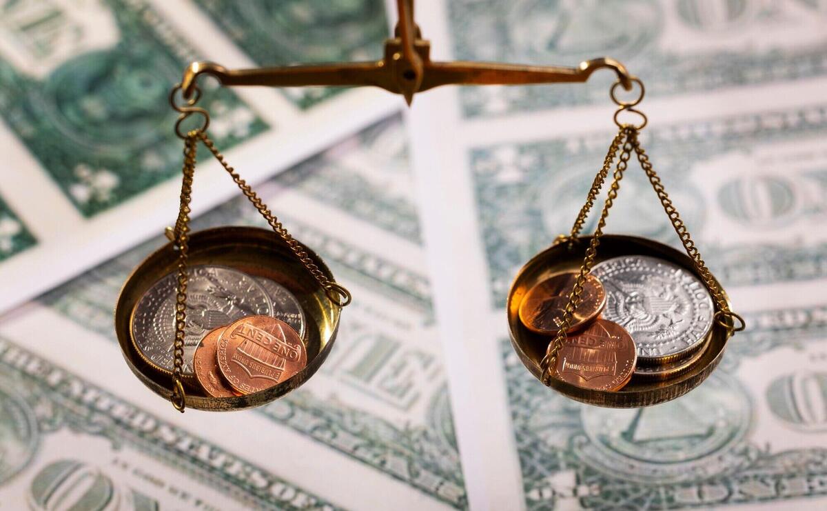 Still life of dollar coins in scale