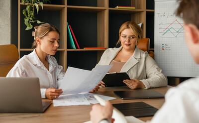 Plus-size woman business woman working with colleagues in a professional office