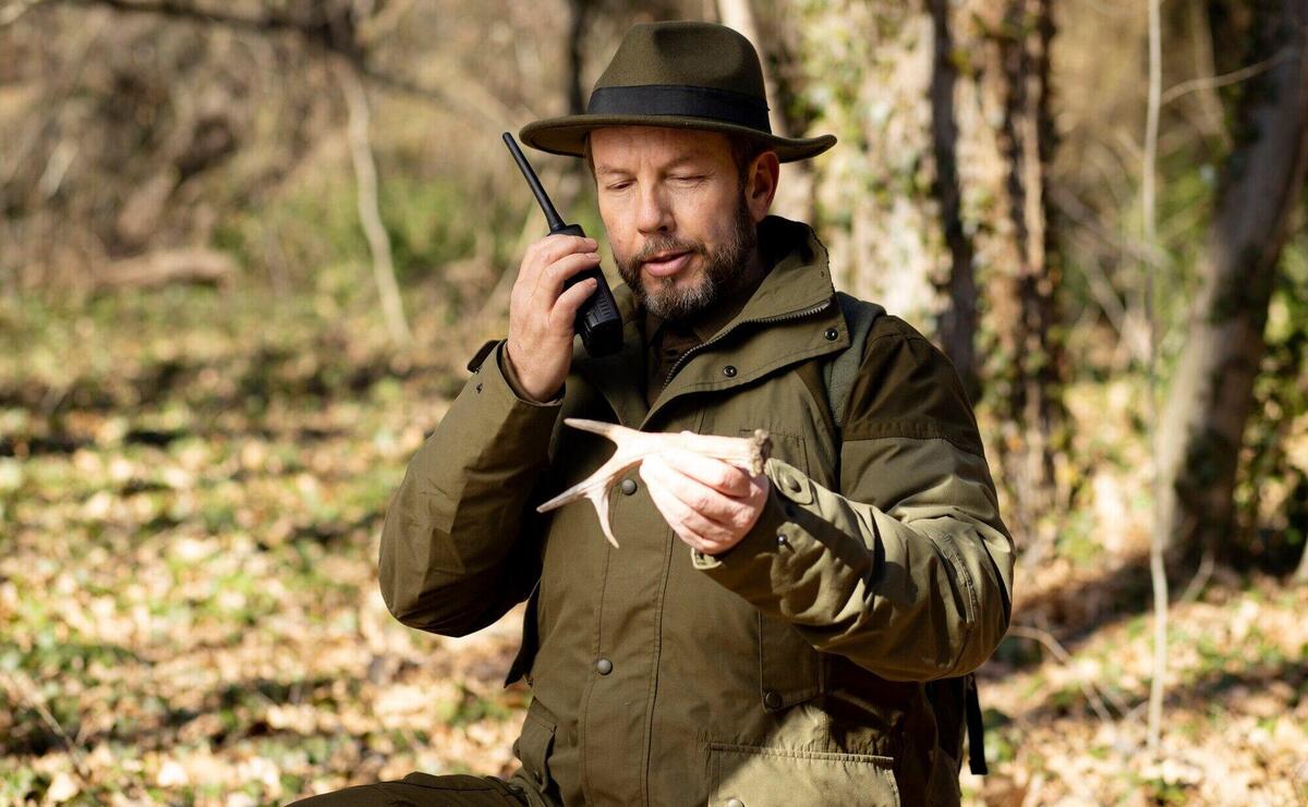 Close up on park ranger in woods