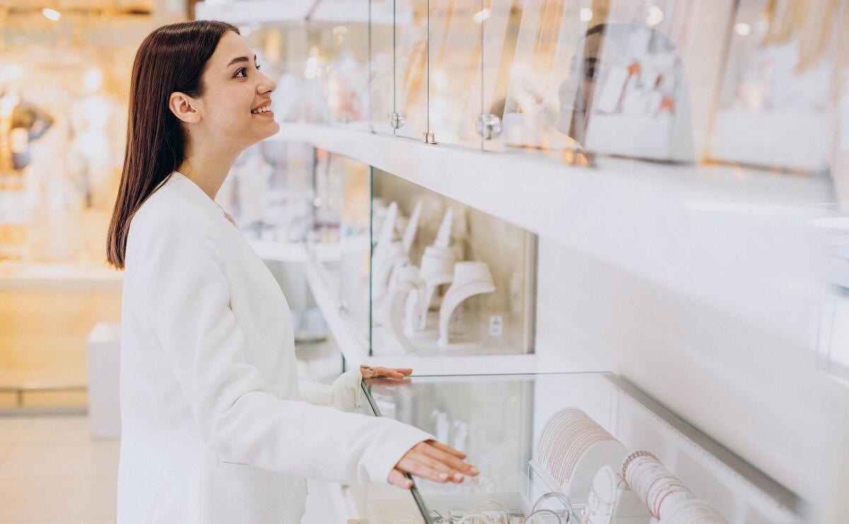 Woman choosing jewelry at jewelry shop