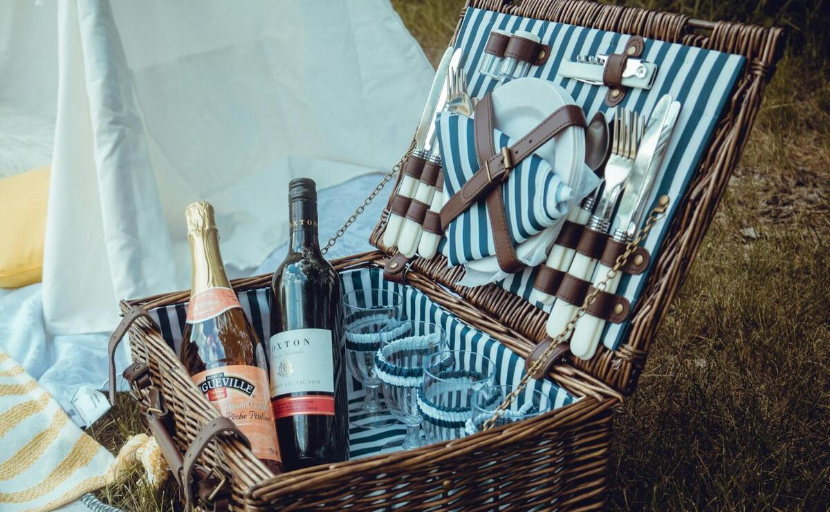 wine bottles in brown woven basket