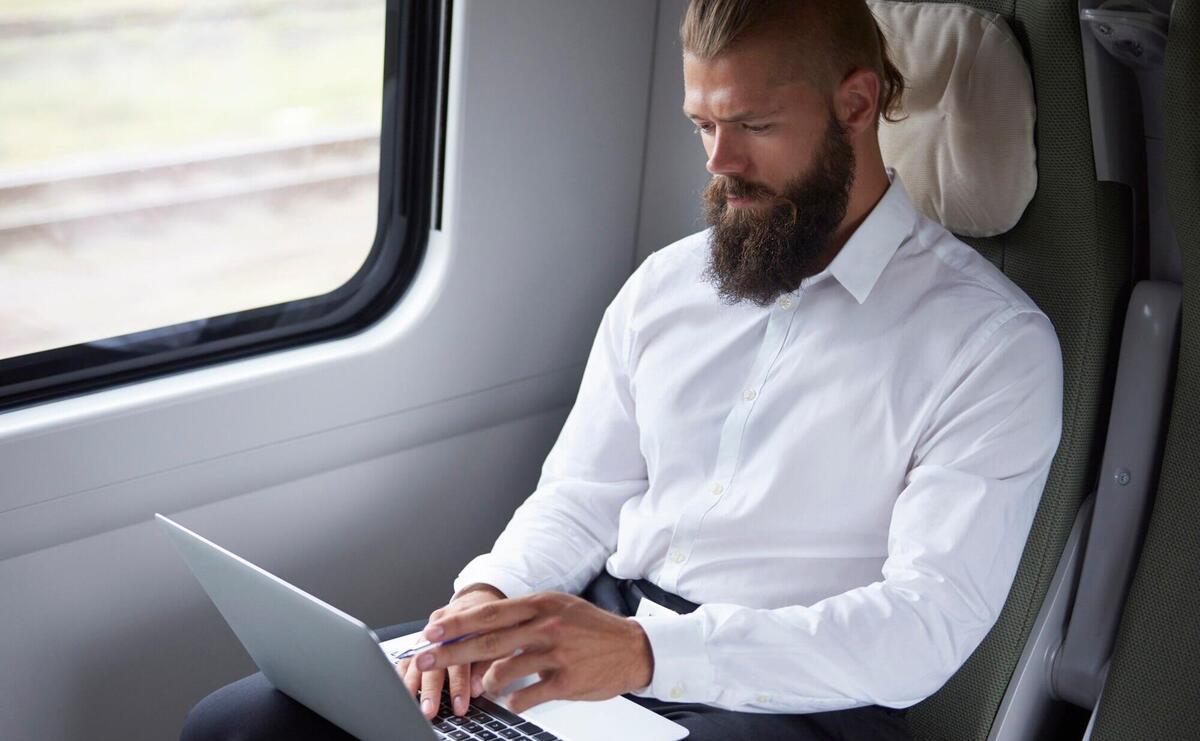 Modern businessman working in the train